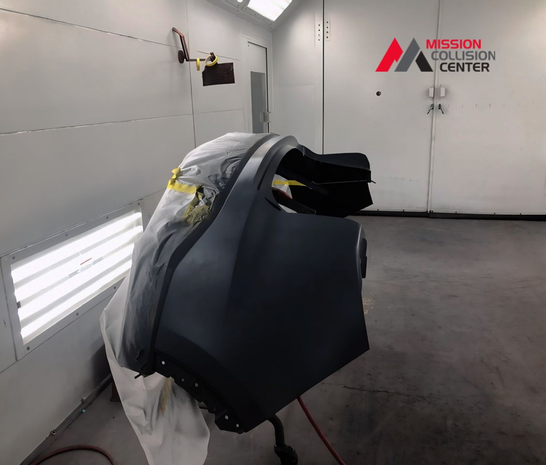 vehicle parts in paint booth at mission collision san antonio tx